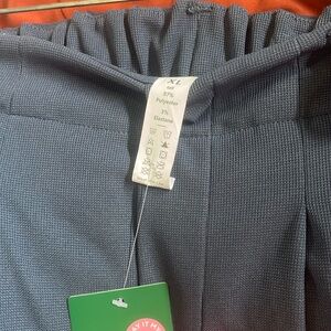 HALARA placated, side pockets, tall length one blue and one pair of ivory